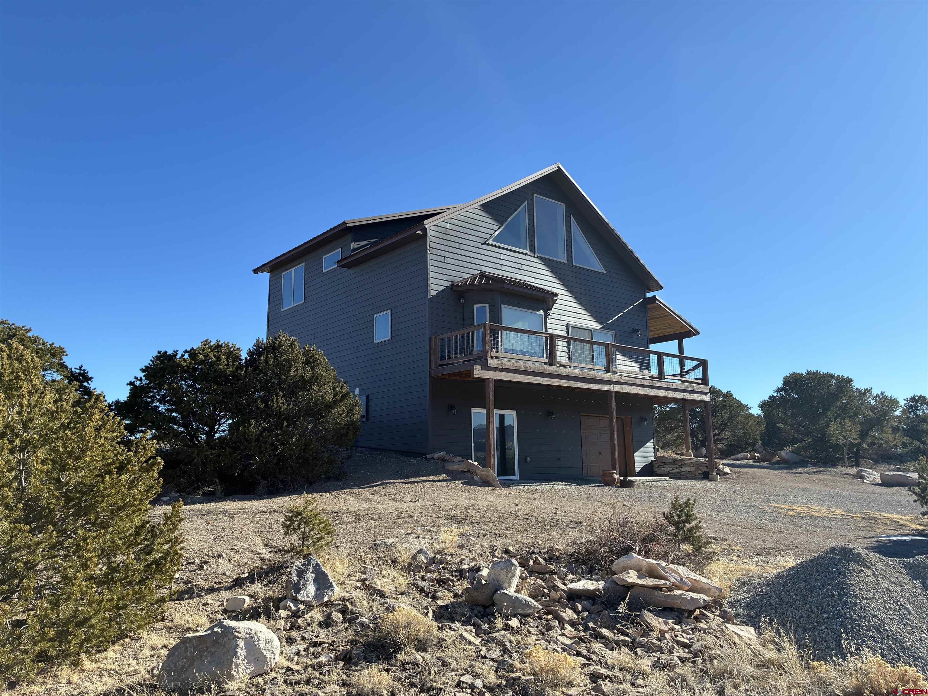 180 Boulder Lake Road Monte Vista, CO 81144 - Photo 4 of 35 a front view of a house with a yard