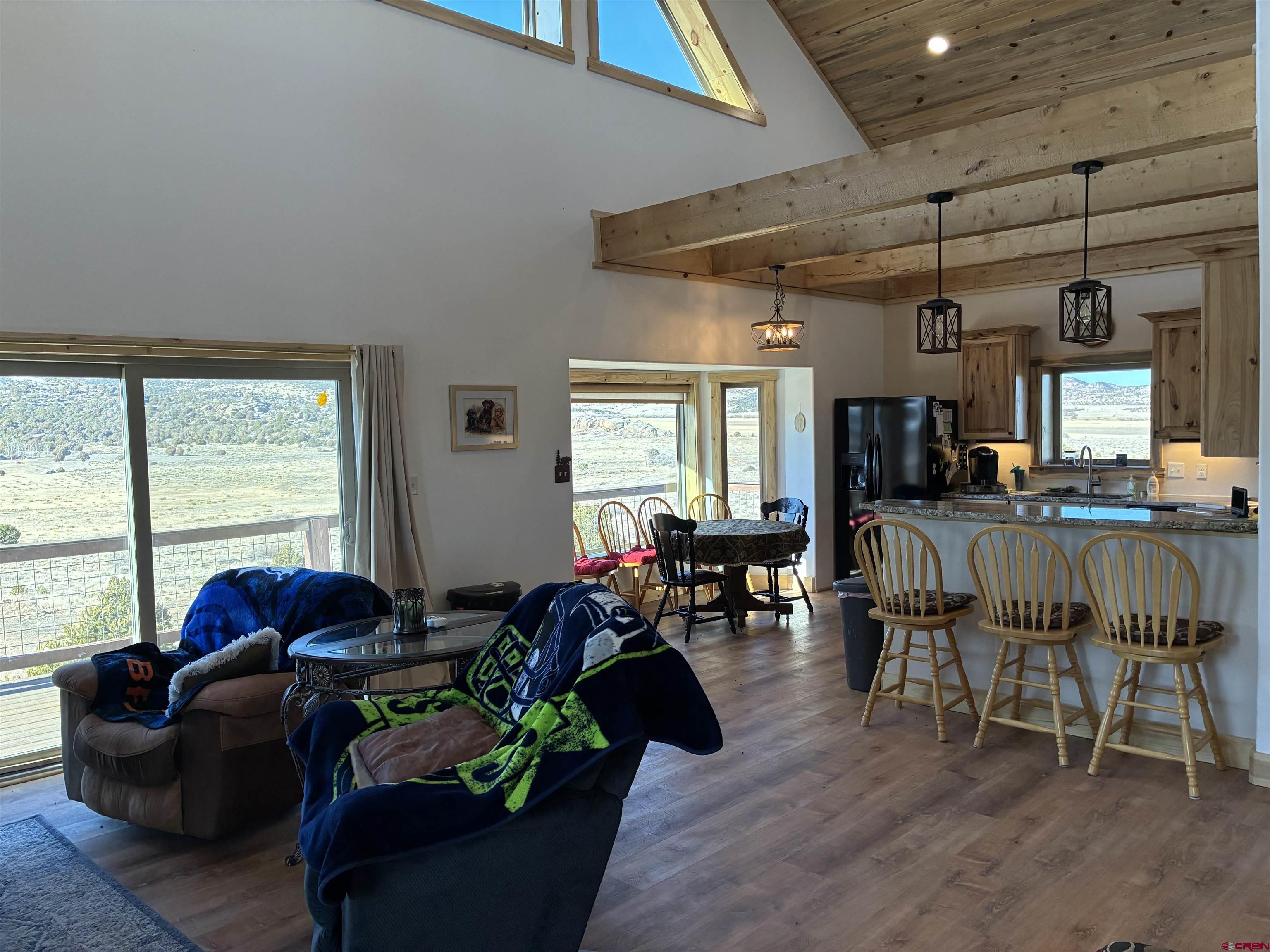 180 Boulder Lake Road Monte Vista, CO 81144 - Photo 6 of 35 a living room with furniture and a large window