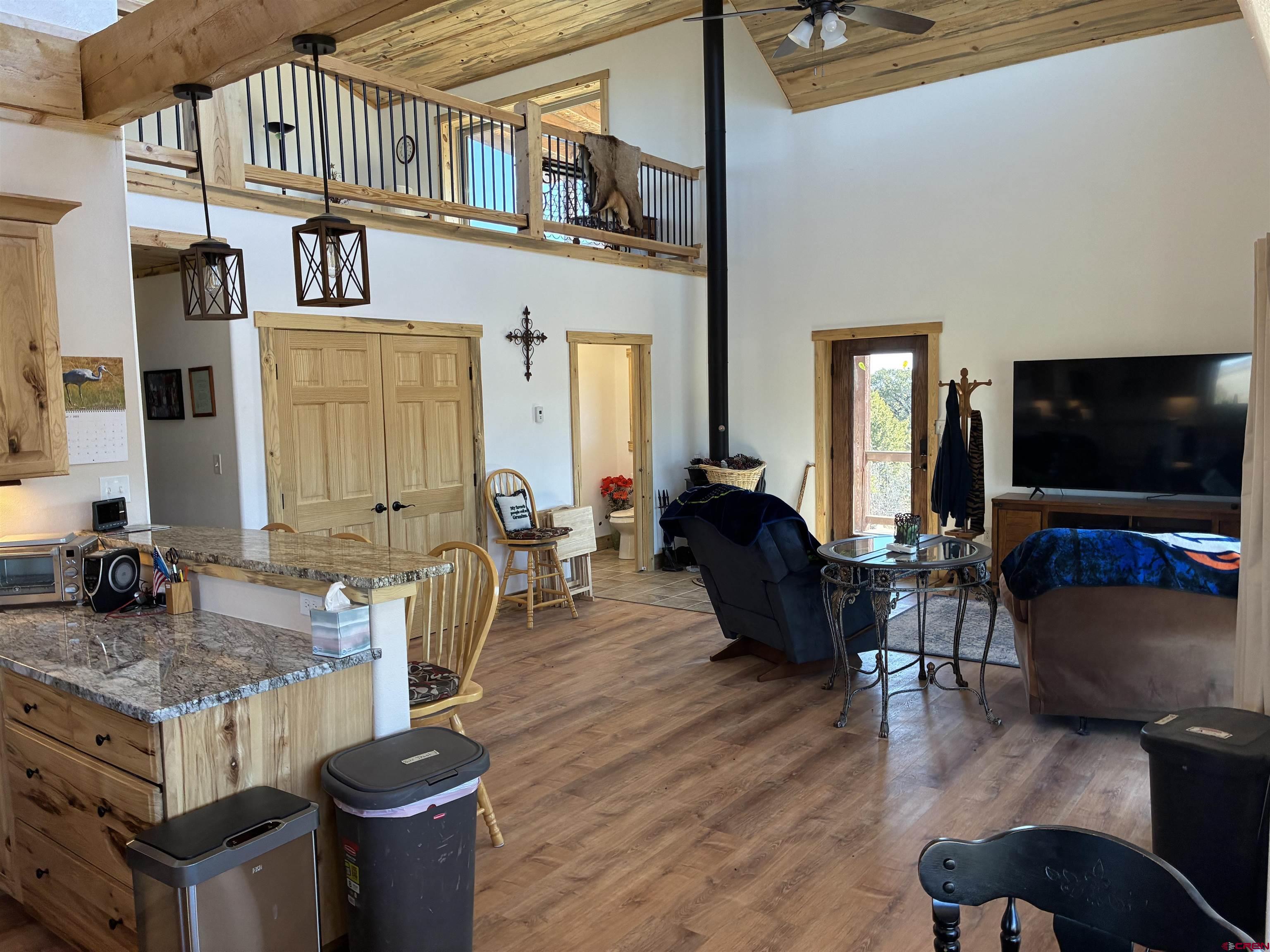 180 Boulder Lake Road Monte Vista, CO 81144 - Photo 10 of 35 a living room with furniture and a flat screen tv