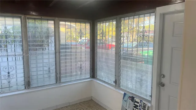 a view of empty room with windows