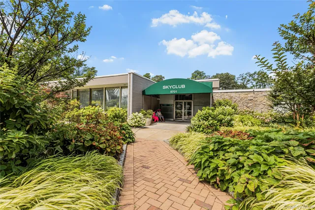 a view of house with yard outdoor seating and entertaining space