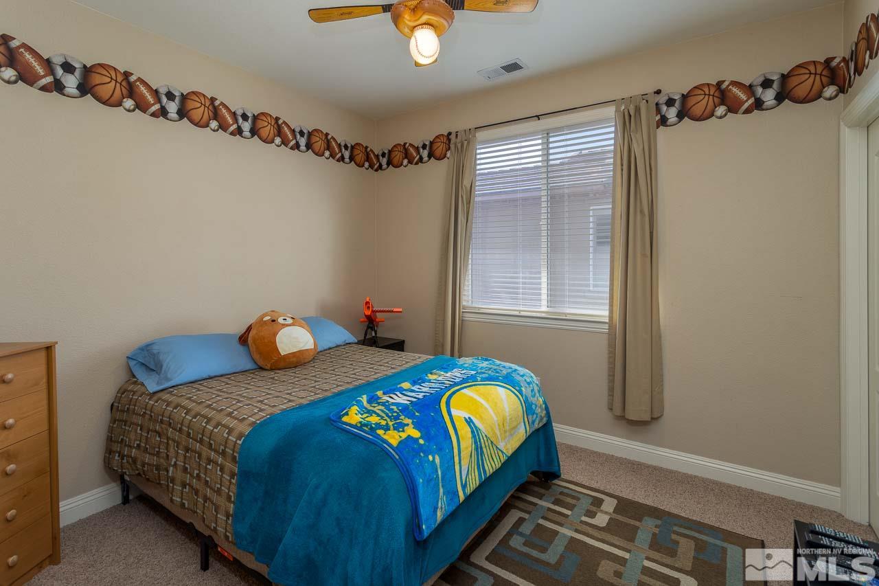 621 Steeplechase Court Reno, NV 89521 - Photo 12 of 18 a bedroom with bed and window
