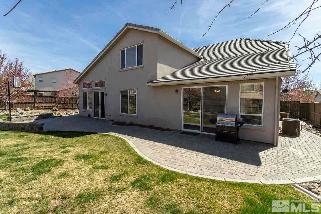 621 Steeplechase Court Reno, NV 89521 - Photo 16 of 18 a view of a house with swimming pool and sitting area