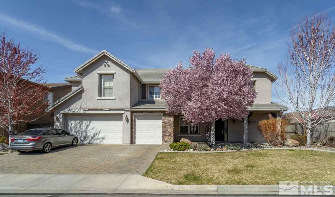 621 Steeplechase Court Reno, NV 89521 - Photo 18 of 18 a view of a house with a cars park side of a road