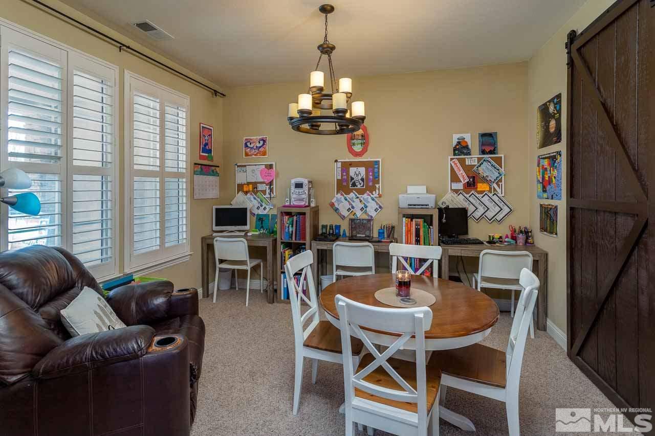 621 Steeplechase Court Reno, NV 89521 - Photo 3 of 18 a view of a dining room with furniture window and outside view
