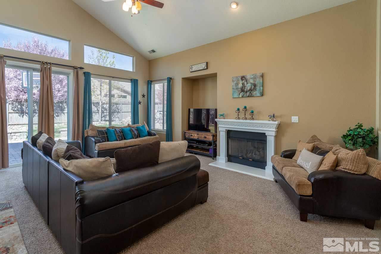 621 Steeplechase Court Reno, NV 89521 - Photo 5 of 18 a living room with furniture and a fireplace