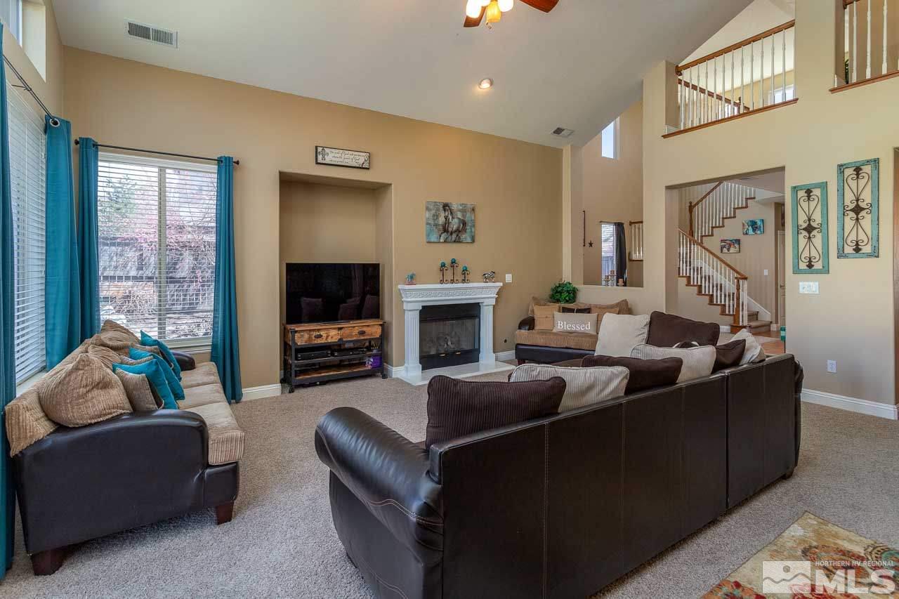 621 Steeplechase Court Reno, NV 89521 - Photo 6 of 18 a living room with furniture and a flat screen tv