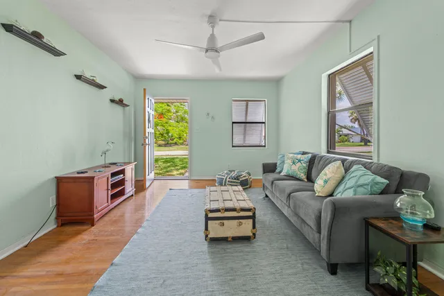 a workspace with furniture and wooden floor