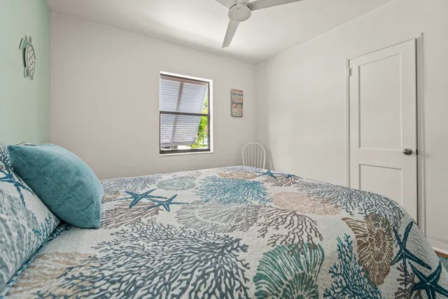 an aerial view of a house with swimming pool and patio