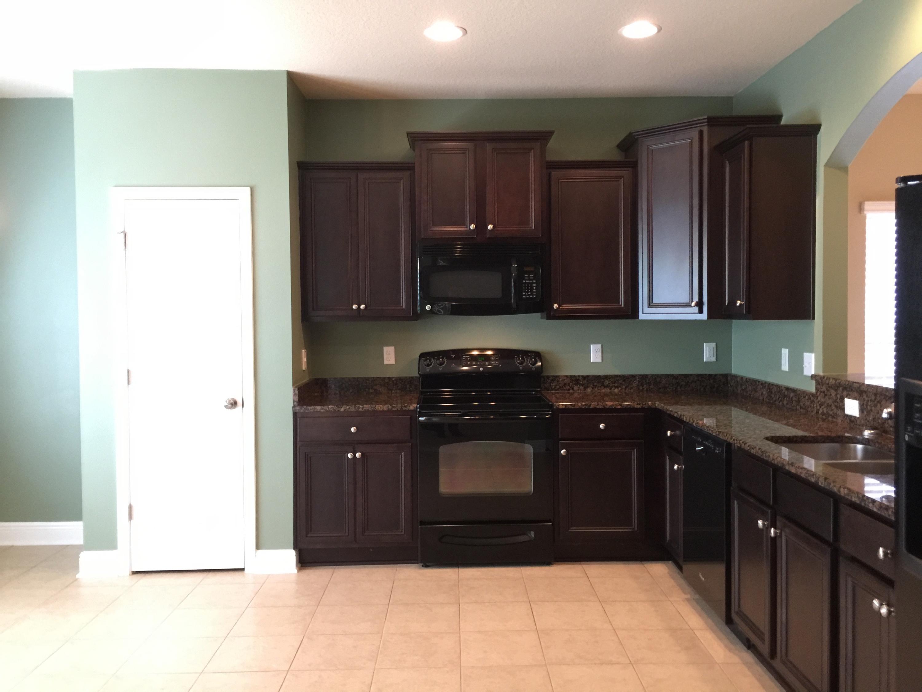 660 Red Fern Road Crestview, FL 32536 - Photo 12 of 32 a kitchen with a sink and a stove top oven