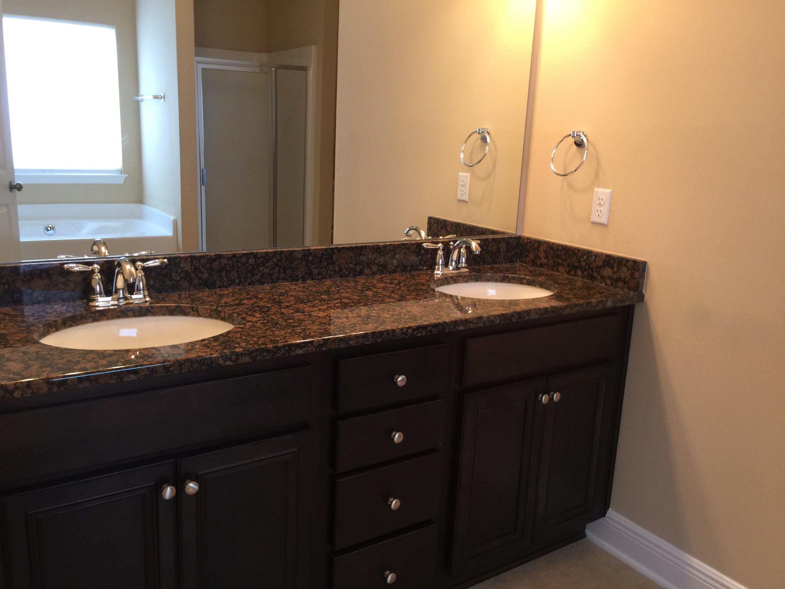 660 Red Fern Road Crestview, FL 32536 - Photo 15 of 32 a bathroom with a granite countertop sink and a mirror
