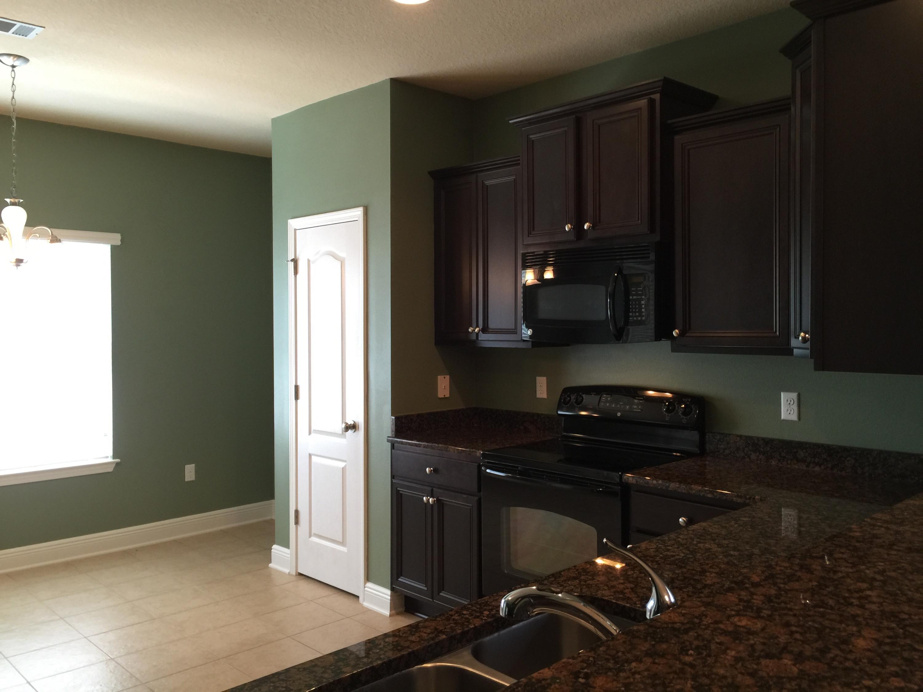 660 Red Fern Road Crestview, FL 32536 - Photo 7 of 32 a kitchen with a sink a stove and cabinets