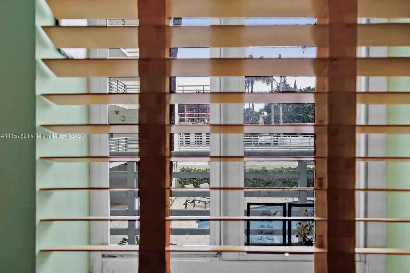 1401 Bay Road, Unit 209 Miami Beach, FL 33139 - Photo 20 of 37 Kitchen Window with View to Pool