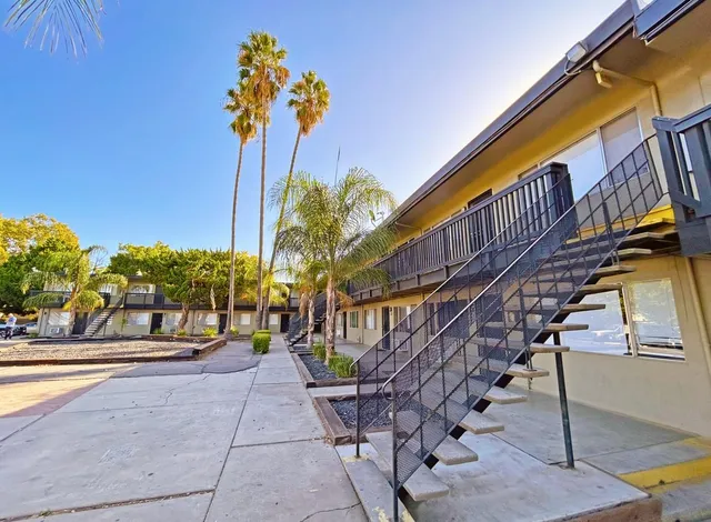a view of a pathway with a house in the background