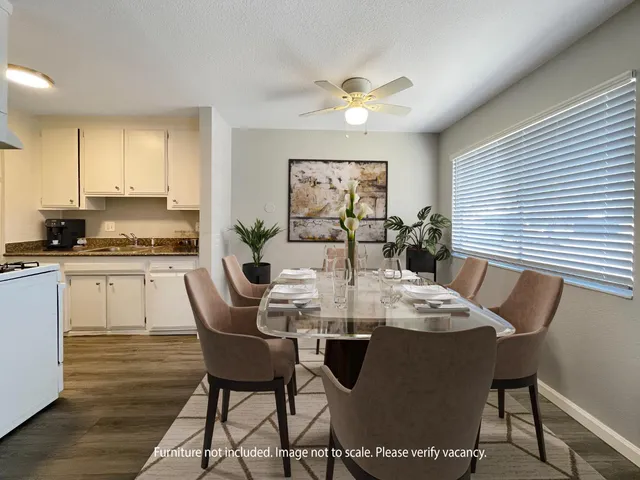 a dining room with furniture and window