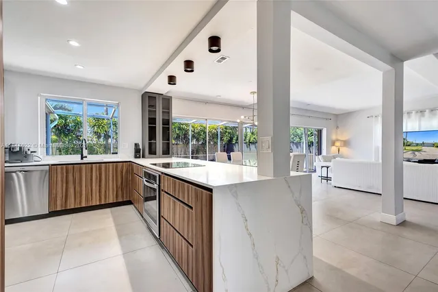 a kitchen with a sink and large window