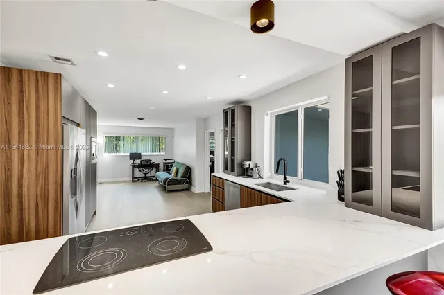 a view of a living room and kitchen
