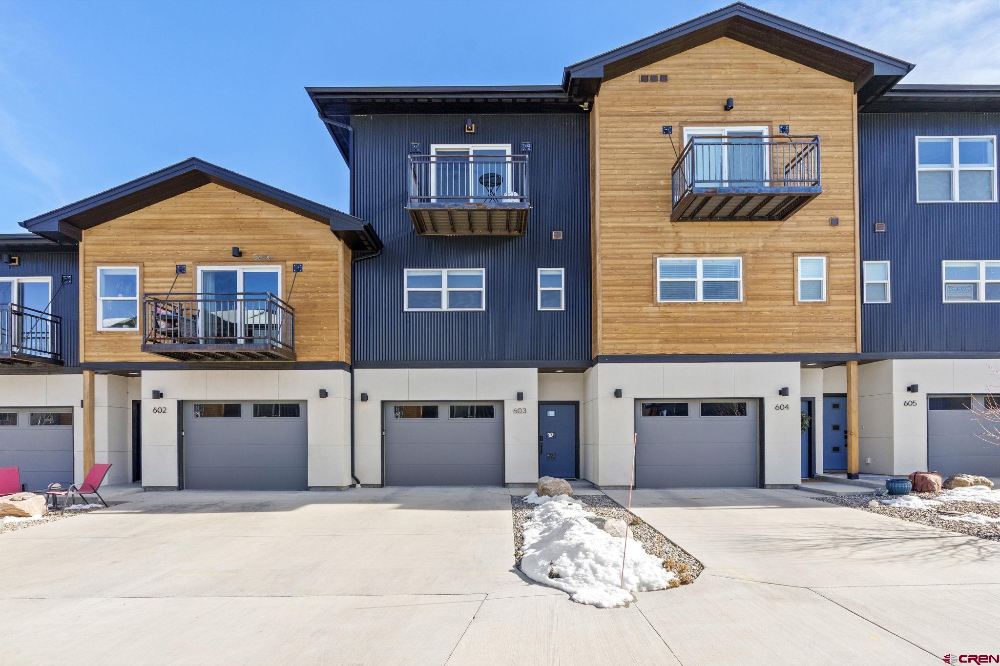 220 Metz Lane, Unit 603 Durango, CO 81301 - Photo 1 of 21 a front view of a house with a yard