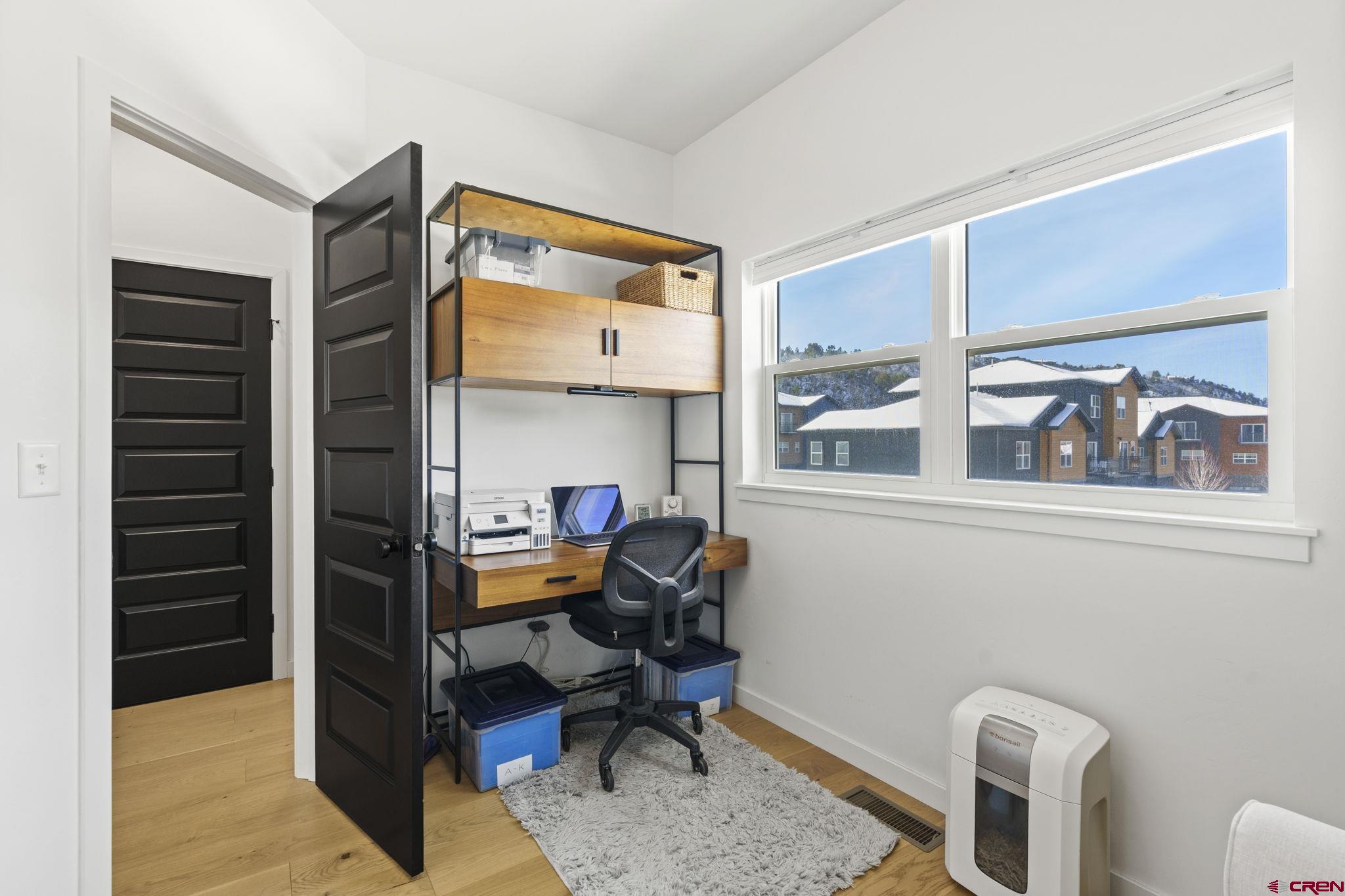 220 Metz Lane, Unit 603 Durango, CO 81301 - Photo 16 of 21 a view of a workspace with furniture and a window