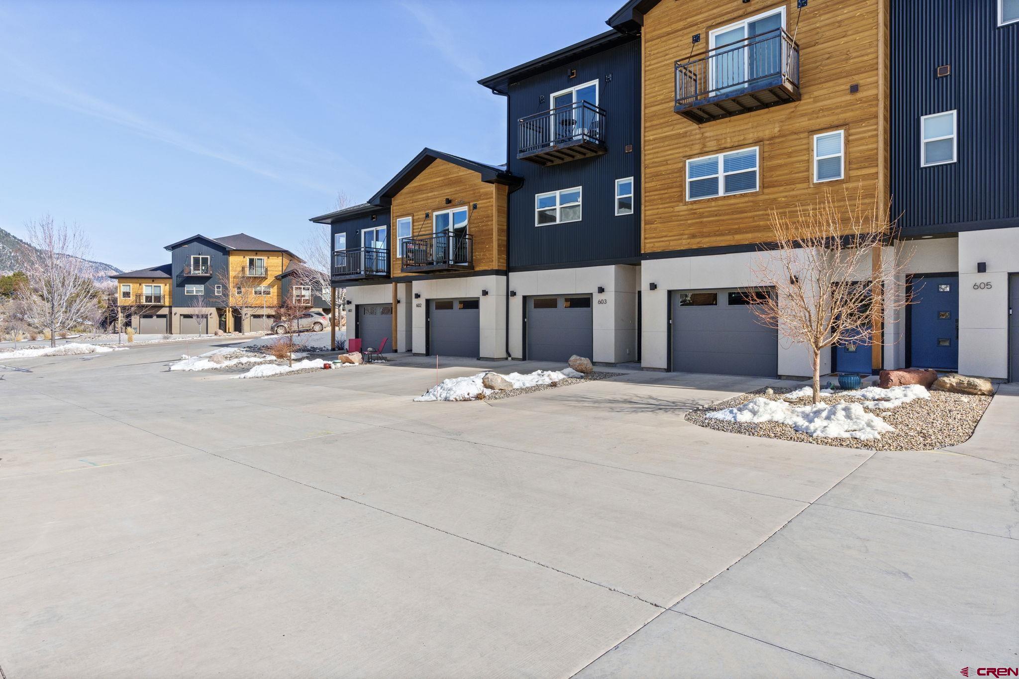 220 Metz Lane, Unit 603 Durango, CO 81301 - Photo 20 of 21 a front view of a building with large trees