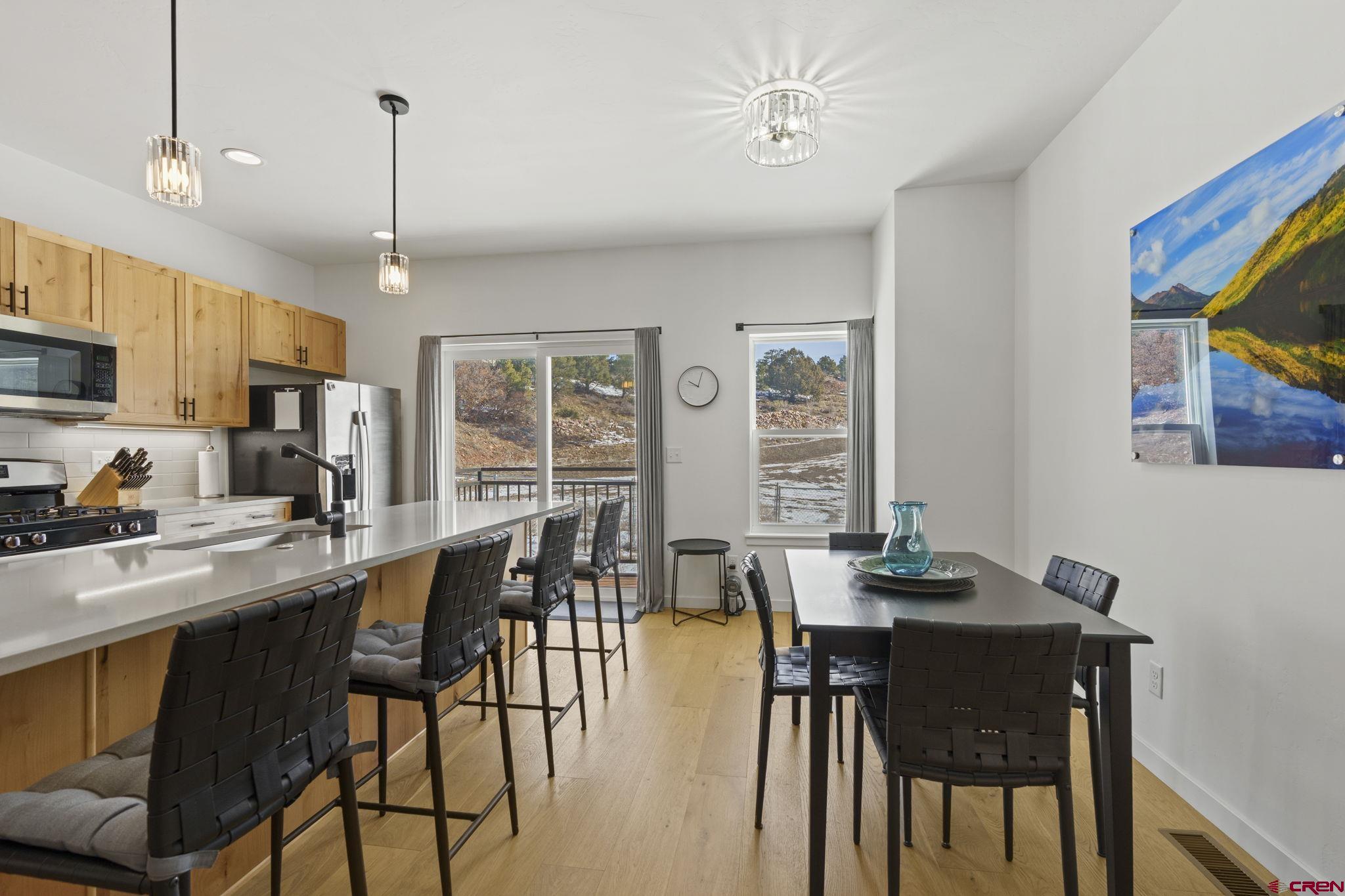 220 Metz Lane, Unit 603 Durango, CO 81301 - Photo 4 of 21 a view of a dining room with furniture window and outside view