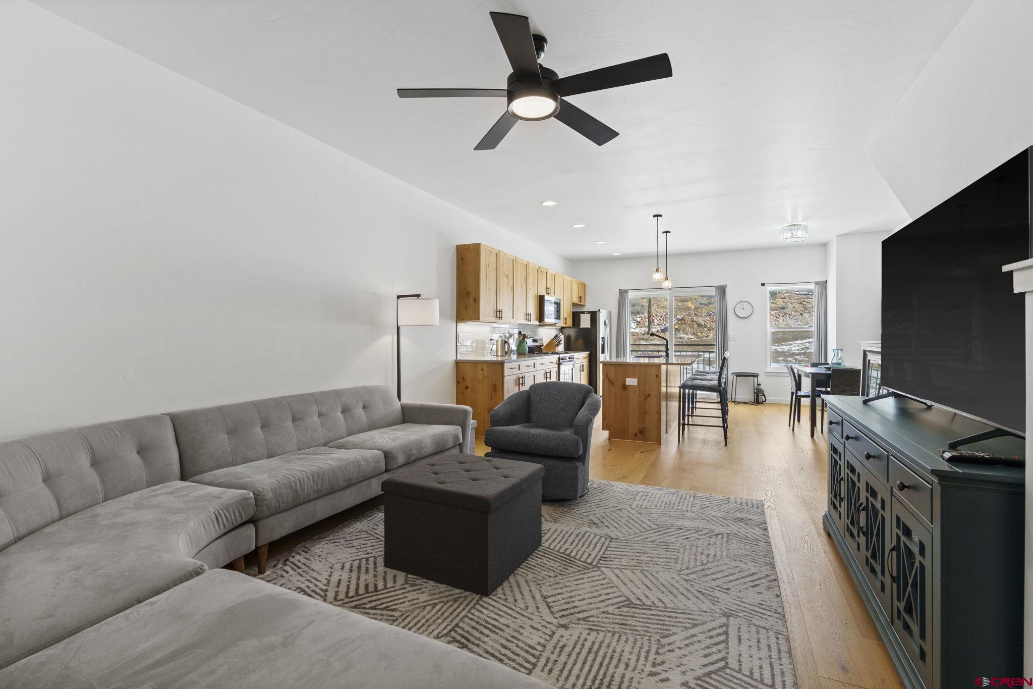 220 Metz Lane, Unit 603 Durango, CO 81301 - Photo 6 of 21 a living room with furniture and a flat screen tv
