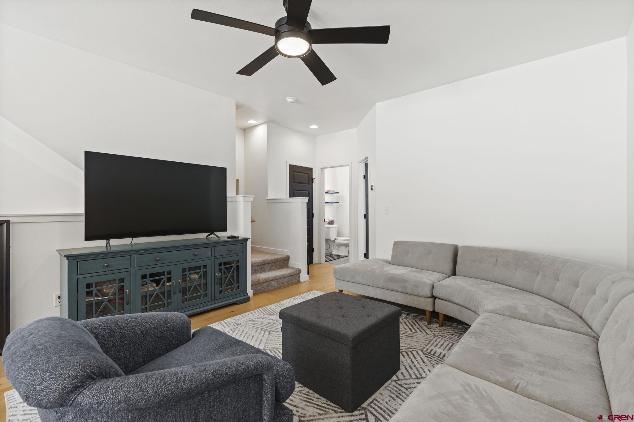 220 Metz Lane, Unit 603 Durango, CO 81301 - Photo 7 of 21 a living room with furniture and a flat screen tv