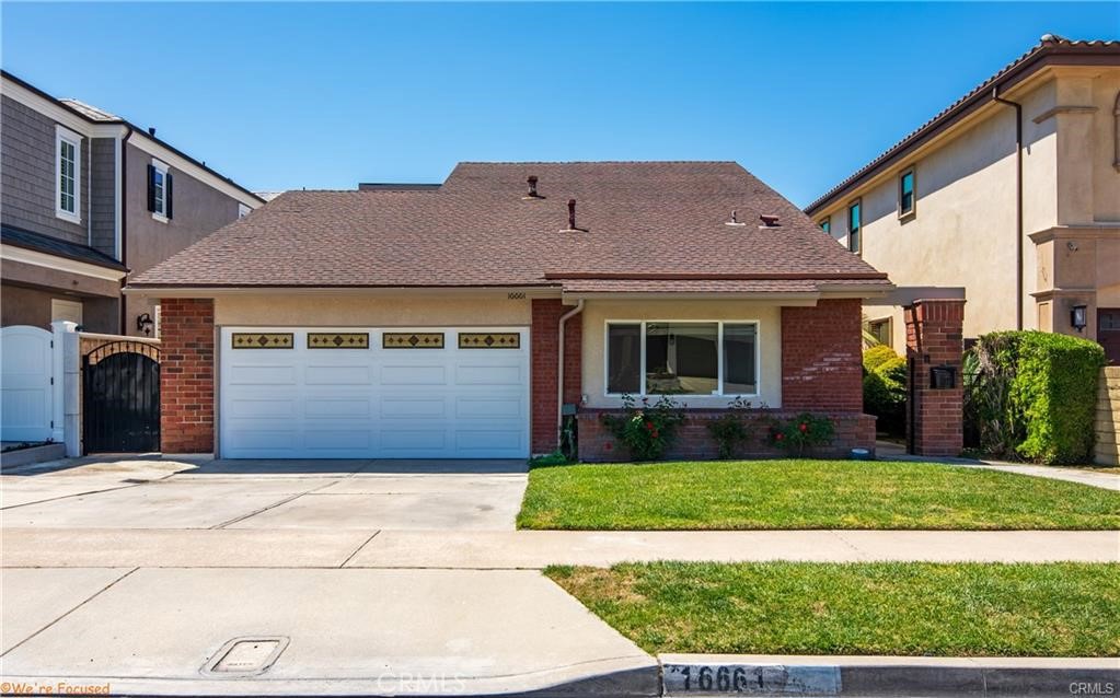 16661 Carousel Lane Huntington Beach, CA 92649 - Photo 2 of 47 a front view of a house with a yard