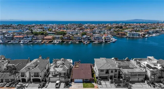 an aerial view of a city with ocean view
