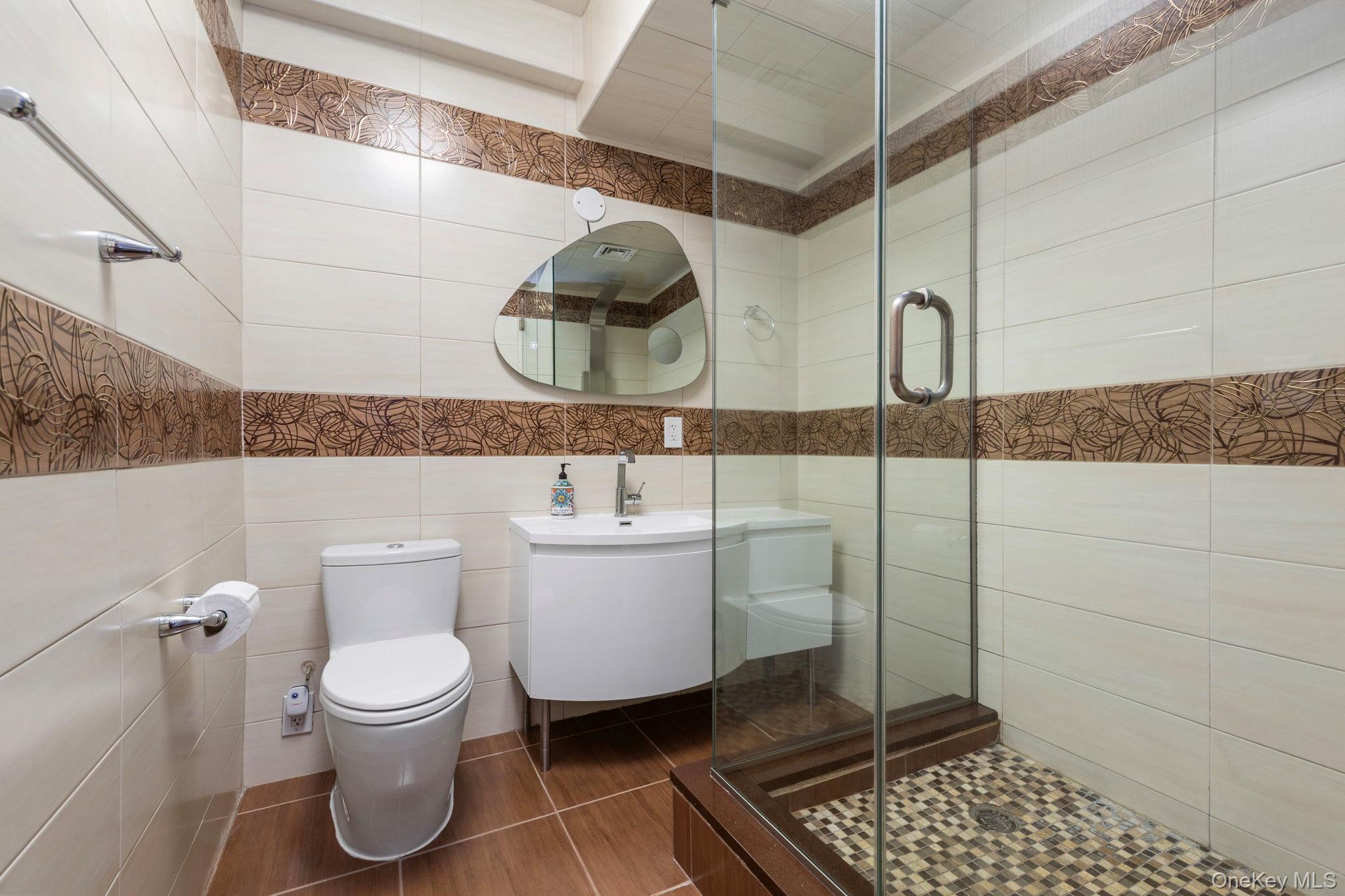 99-72 66th Road, Unit 1Z Queens, NY 11374 - Photo 10 of 16 a bathroom with a toilet and a sink