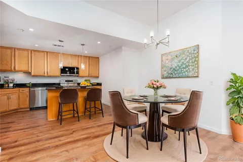 a view of kitchen with cabinets table and chairs