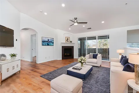 a living room with furniture rug and window