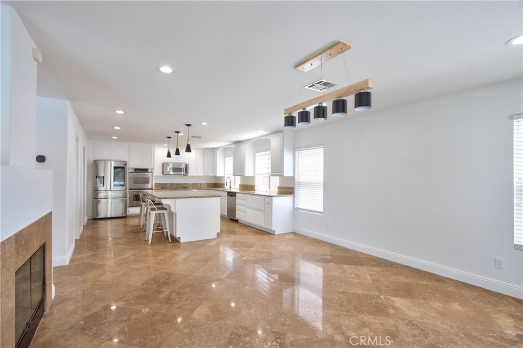 23126 Teil Glen Road Wildomar, CA 92595 - Photo 15 of 48 a kitchen with a sink and chairs