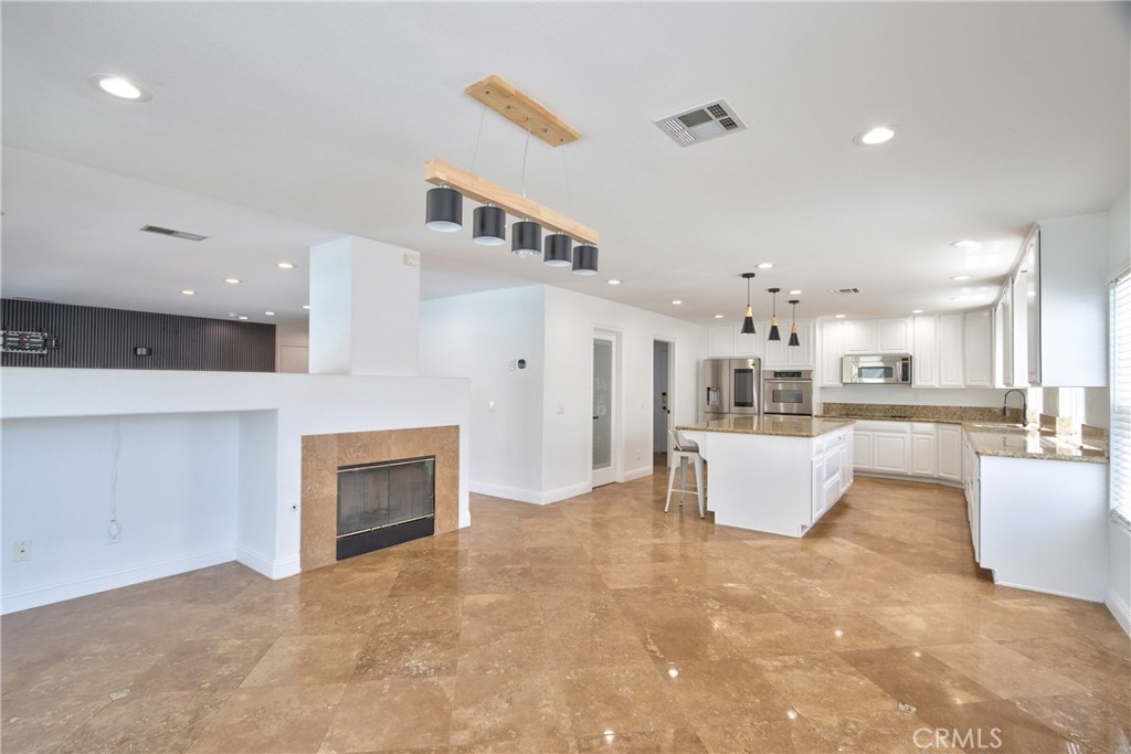 23126 Teil Glen Road Wildomar, CA 92595 - Photo 16 of 48 a living room with furniture and a fireplace
