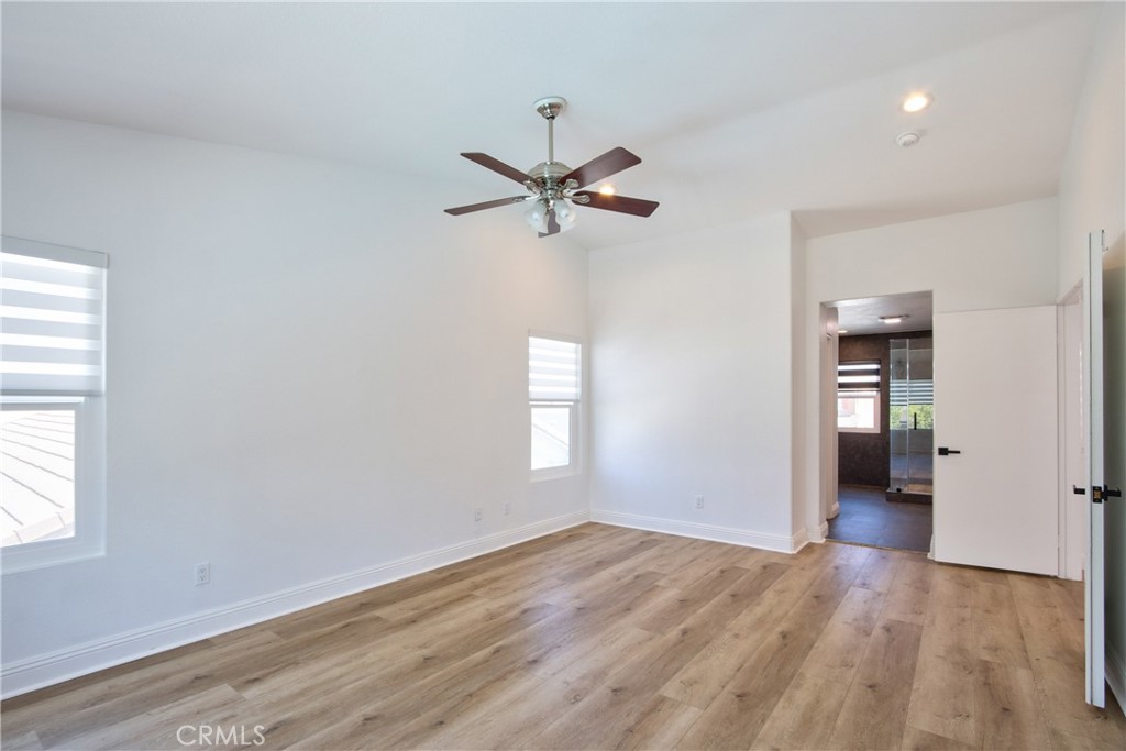 23126 Teil Glen Road Wildomar, CA 92595 - Photo 19 of 48 wooden floor in an empty room with a window