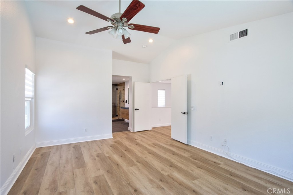23126 Teil Glen Road Wildomar, CA 92595 - Photo 20 of 48 wooden floor in an empty room with a window