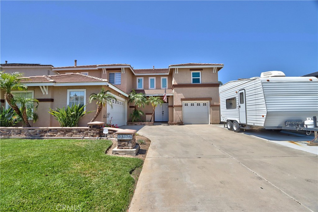23126 Teil Glen Road Wildomar, CA 92595 - Photo 2 of 48 a view of a house with backyard and sitting area