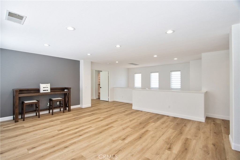 23126 Teil Glen Road Wildomar, CA 92595 - Photo 27 of 48 a bedroom with a bed and a desk