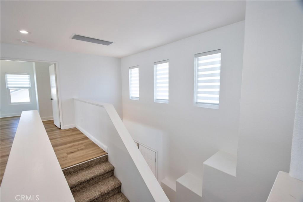 23126 Teil Glen Road Wildomar, CA 92595 - Photo 28 of 48 a view of staircase with white walls and windows