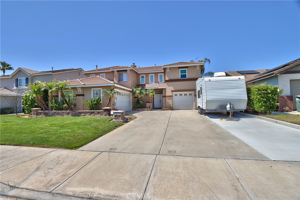 23126 Teil Glen Road Wildomar, CA 92595 - Photo 3 of 48 a front view of a house with a yard