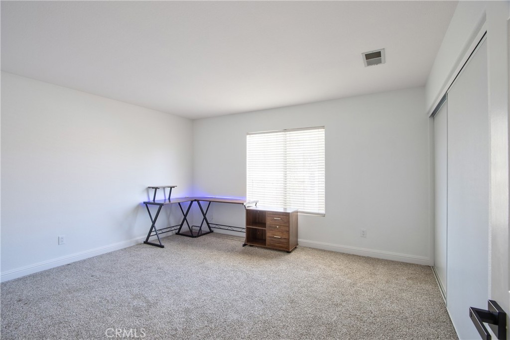 23126 Teil Glen Road Wildomar, CA 92595 - Photo 31 of 48 a view of workspace and bedroom with furniture