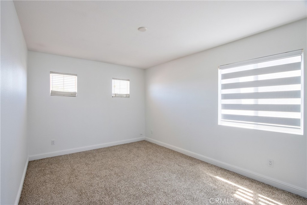 23126 Teil Glen Road Wildomar, CA 92595 - Photo 33 of 48 a view of an empty room with a window