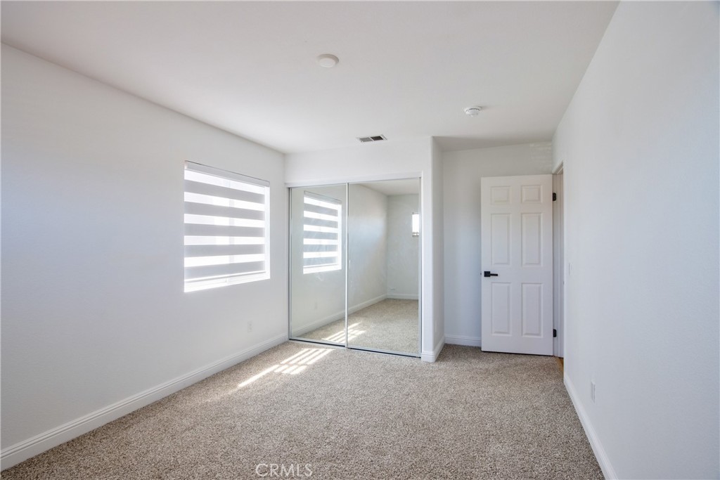 23126 Teil Glen Road Wildomar, CA 92595 - Photo 34 of 48 a view of an empty room with a window