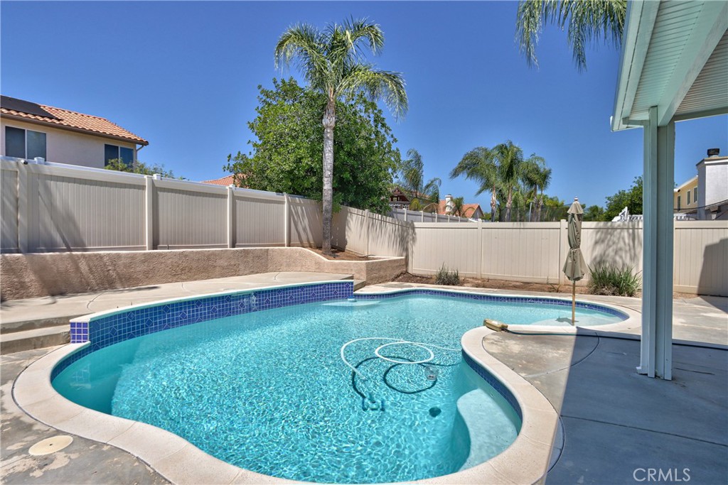 23126 Teil Glen Road Wildomar, CA 92595 - Photo 43 of 48 a swimming pool with outdoor seating and yard