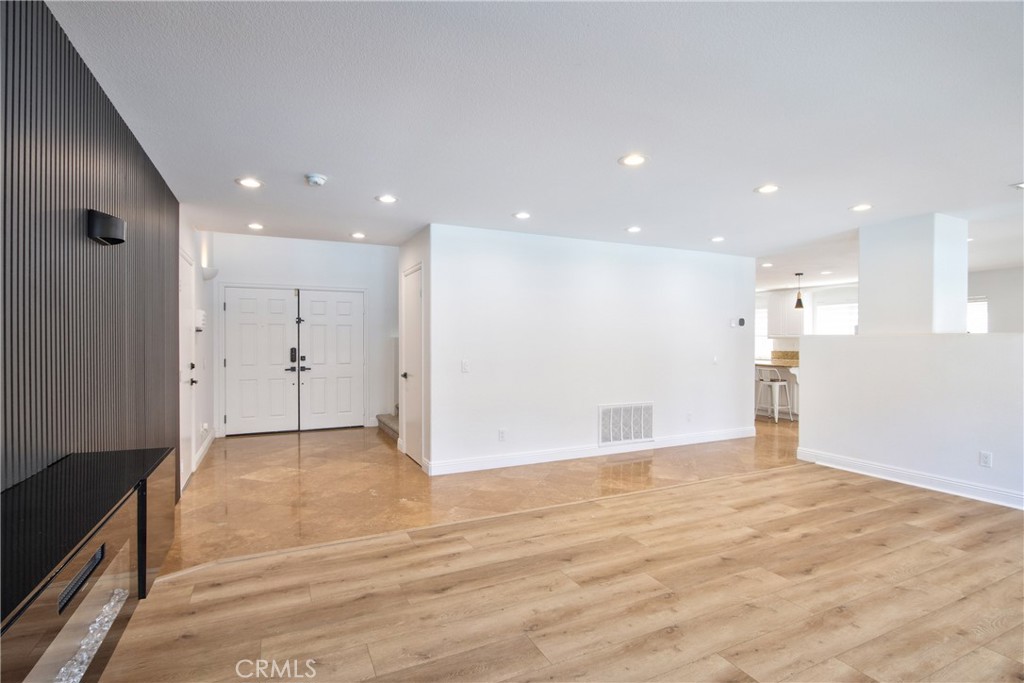23126 Teil Glen Road Wildomar, CA 92595 - Photo 8 of 48 a view of an empty room with wooden floor