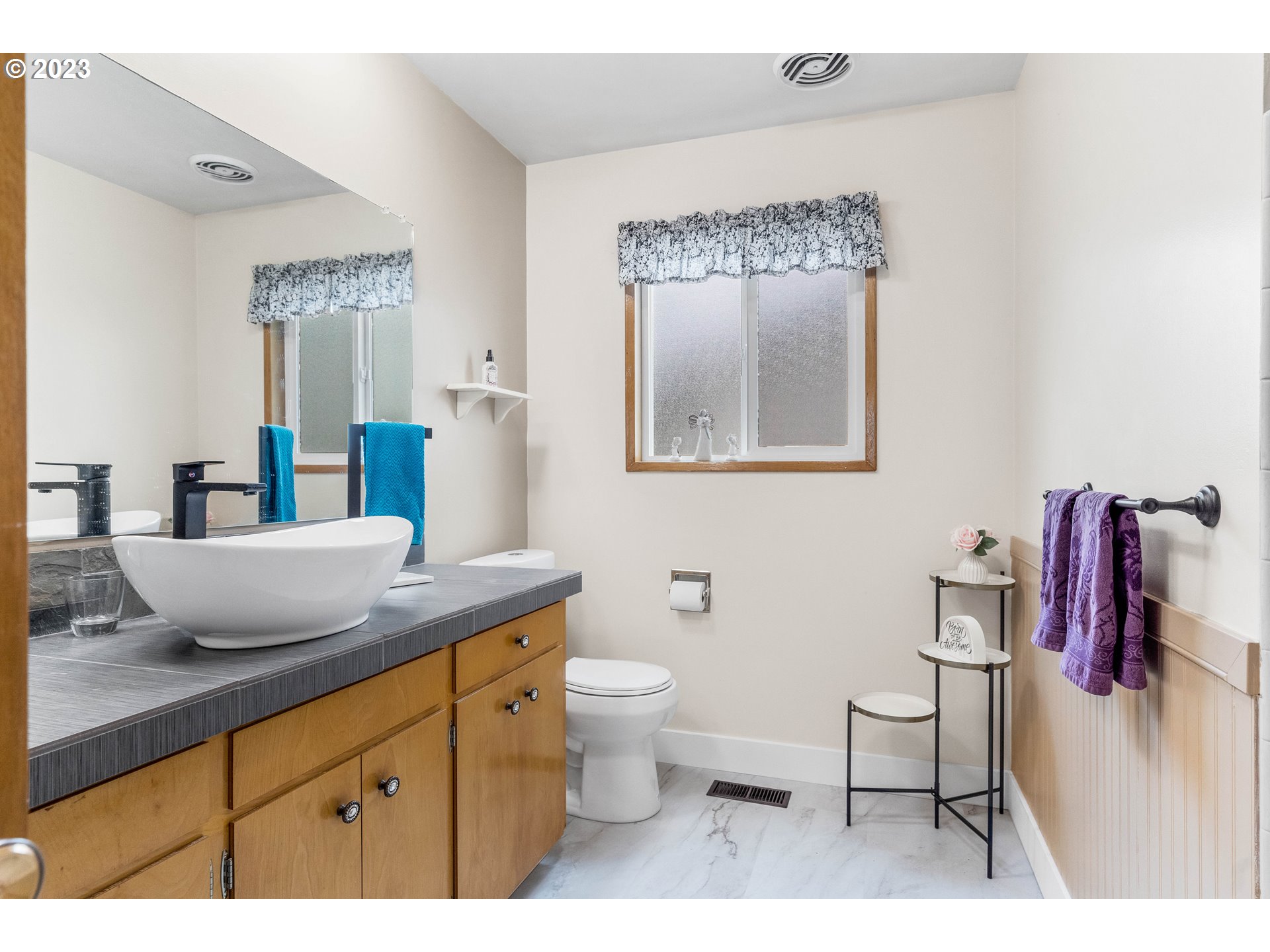 943 Oregon Way Woodburn, OR 97071 - Photo 16 of 39 a bathroom with a granite countertop sink mirror vanity and toilet