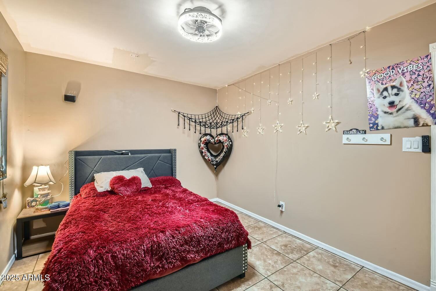 9031 North 14th Street Phoenix, AZ 85020 - Photo 17 of 33 a bedroom with a bed and a table in it