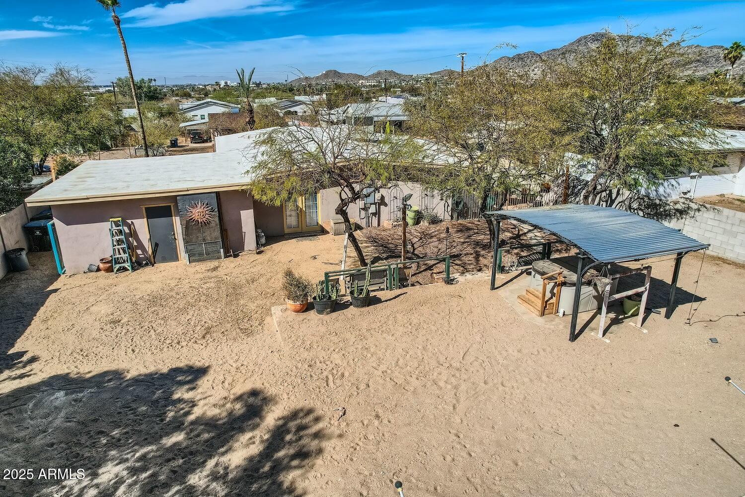 9031 North 14th Street Phoenix, AZ 85020 - Photo 25 of 33 a view of a terrace with furniture and a garden