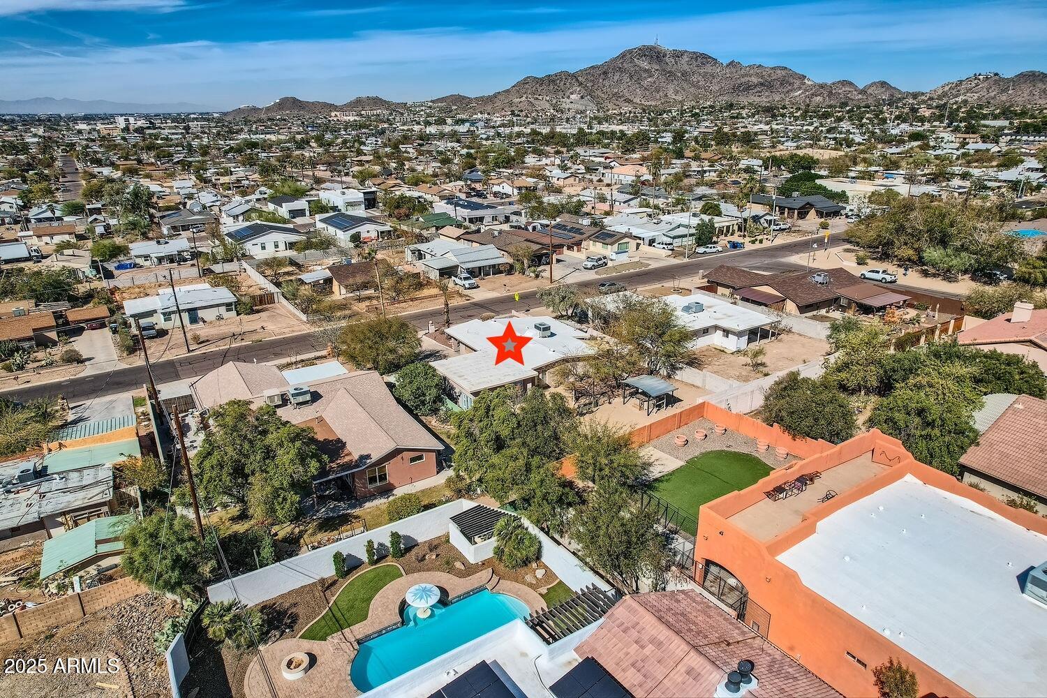 9031 North 14th Street Phoenix, AZ 85020 - Photo 30 of 33 an aerial view of residential houses with outdoor space