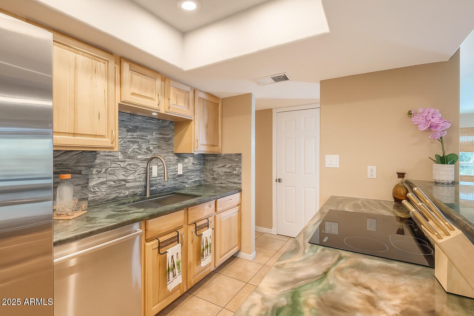 9031 North 14th Street Phoenix, AZ 85020 - Photo 9 of 33 a bathroom with a granite countertop sink and a mirror